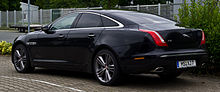 Picture of a black Jaguar XJ in a dark environment