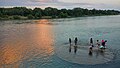 Locals playing in the Guilin section of the Li River in Guanxi Province, China.