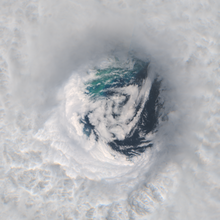 A satellite image of the eye of a major hurricane over the Caribbean Sea.