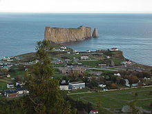 An aerial view of the village of Percé, Quebec, and its famous rock, taken from Mont-Sainte-Anne