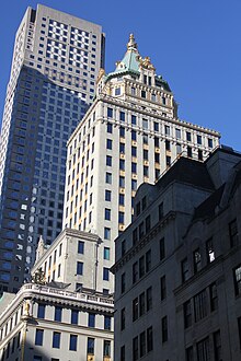 The Crown Building as seen from one block north. 712 Fifth Avenue is in the background, and the Bergdorf Goodman Building is in the foreground.