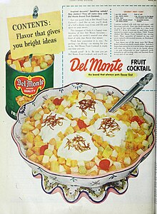 The advertisement shows the can, a recipe, and a large bowl of diced, canned fruit with white custard and homemade toasted coconut on top
