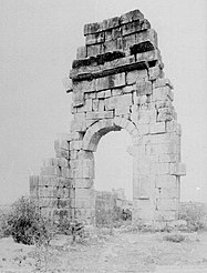 Photograph showing a standing fragment of a wall of the basilica in 1887