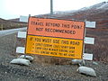 Sign north of Nome, Alaska, providing warning of the road, unpopulated area beyond