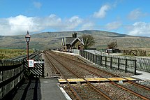 The station at Ribblehead is located to the south of the Ribblehead Viaduct.