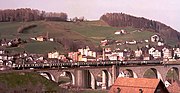 Push-pull set with motor coach in green and cream livery on the Glatttal viaduct (Herisau)