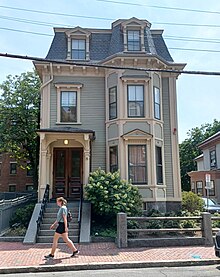 Three-story home with a small footprint and intricate trim