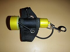 Small dive light on soft Goodman type handle, side view