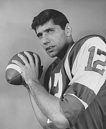 Joe Namath without a helmet holding a football