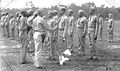 Lieutenant Colonel Frazier, Commanding Officer, Montford Point Camp, presents the World War II Victory Medal to members of the Montford Point Camp, and the 51st, and 52nd Defense Battalions.
