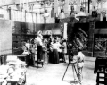 Image 26A.E. Smith filming The Bargain Fiend in the Vitagraph Studios in 1907. Arc floodlights hang overhead. (from History of film)