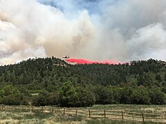 Airplane dropping fire retardant on June 18, 2020