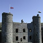 Harlech Castle with flags at half mast after the death of Queen Elizabeth the Queen Mother in 2002