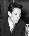 Jacques Brel, 1955. This is a perfect example of a young man's hairstyle, including quiff and sideburns.