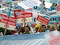 Image 12Union members march in Argentina on Human Rights Day in December 2005. The signs read "Worker rights are human rights..