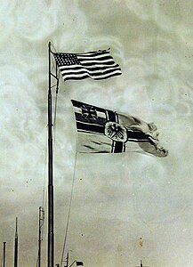 United States and German flags flying above U-111