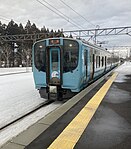 A train of the Aoimori Railway arriving at Kominato Station