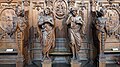 Wooden carvings of four angels on the left side of the main hall