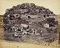 General view inside Fort, with Europeans and party posed in the foreground, Chitradurga