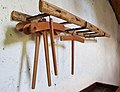 A ladder repurposed as a coat rack in Sardinia
