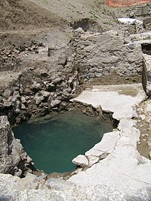 The floor of the southern temple was perforated by a water-filled basin, half of which was excavated, the other half not being excavated as it lay outside the archaeological excavation area.