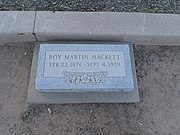 The grave site of Roy Martin Hackett (1877-1945). Hackett was a pioneer who owned what is now the oldest fired brick building in Tempe. The building is listed in the National Register of Historic Places in 1974, reference #74000458. He is buried in Sec. E.