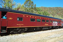 A Tuscan red streamlined passenger car