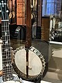 Rim of layered German silver and wood. Wood here is inlaid. Presentation banjos were meant to be fine works of art.