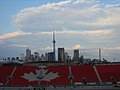 A view of the east side seats of BMO Field with the CN Tower in the background.