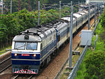 A China Railways DF11 diesel locomotive hauling a through train from Guangzhou to Kowloon, Hong Kong, in 2010