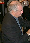 Douglas Adams signing books at ApacheCon 2000