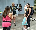 Guests meet an Education Ambassador owl