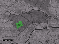 The town centre (dark green) and the statistical district (light green) of Buren in the municipality of Buren.