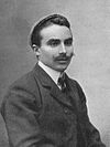 Studio portrait of a man wearing a cap