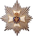 The royal and imperial Cypher of Queen Victoria forms a part of the emblem of the Royal Victorian Order surrounded by a Brunswick star