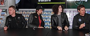 Angels & Airwaves at a signing in April 2012. From left to right: Matt Wachter, David Kennedy, Ilan Rubin, Tom DeLonge.