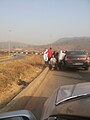 Muslim beggars stalk a car in Nigeria.