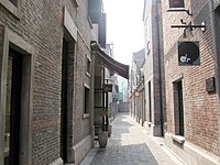 A longtang (弄堂) between shikumen (石库门) townhouses in Shanghai