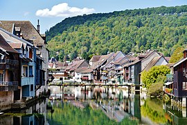 Facades of buildings along the Loue river.