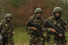 Members of the Special Service Wing (Pakistani Air Force) armed with F2000 rifles during a training exercise at Fort Lewis, Washington, US, July 23, 2007.