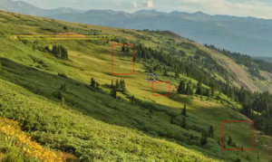 This annotated view shows the damage to the alpine tundra caused by illegal offroading on Rollins Pass. The vehicle is outlined in blue, the tire tracks in red, and the designated road in yellow.