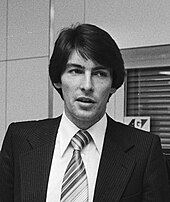 Dark-haired young man wearing suit and tie