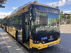 A yellow regional bus at the Uppsala Central Station.