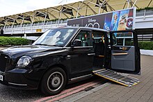 London Taxi with deployed wheelchair ramp