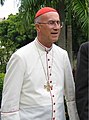 Catholic Cardinal Tarcisio Bertone wearing a tropical white cassock trimmed in cardinalatial scarlet in Santo Domingo, Dominican Republic (2006)