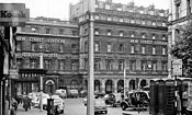 The main entrance to the old station on Stephenson Street, including Queens Hotel in 1962