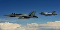 Two Royal Canadian Air Force CF-188 Hornets approach a Colombian A.F. KC-767 tanker