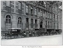 Old cars outside a building