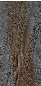 Lineated valley fill in valley, as seen by HiRISE under HiWish program. Linear valley flow is ice covered by debris.