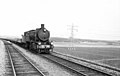 Steam locomotive NS 4439 with a sand train. (Between 1945 - 1950)